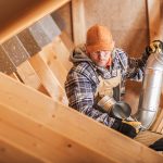 A seasoned contractor with roofing inspects the attic for leaks-experience will inspect your home before recommending insulation or ventilation modifications