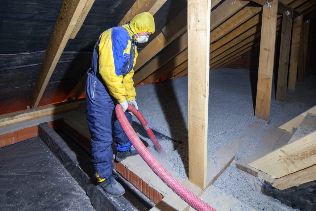 Kusiak's Ventilation and insulation team is in an attic