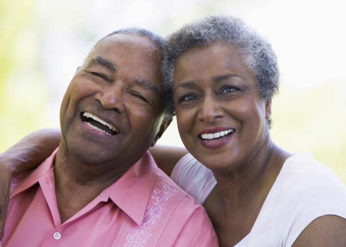 Senior couple relaxing outside A older couple from Gary enjoys confidence that comes with CertainTeed compliance and insurance