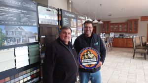 Kusiak and Bob Popovich are tenured CertainTeed Contractors. Here, Dave and Bob proudly display an award