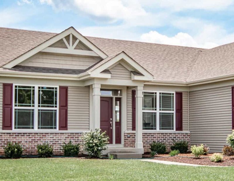 Exterior_windows_with-red-protection-on-beige-color-home-e1651187934617 vinyl replacement windows in northwest indiana
